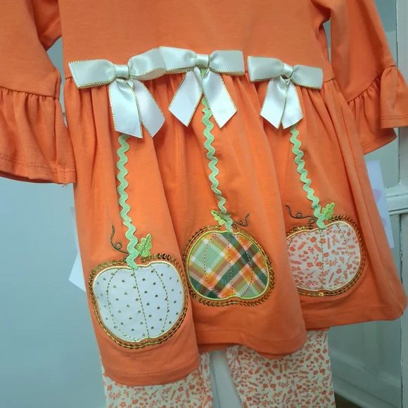Bonnie Jean Orange Pumpkin Tunic with Cream Bows & Printed Leggings - Picture 8 of 9